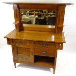 An Arts and Crafts golden oak mirror-back sideboard, circa 1900, with inlaid marquetry motifs and