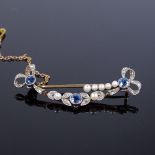 An Edwardian unmarked gold sapphire pearl and diamond brooch, bow and leaf style settings, brooch