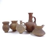 A group of terracotta Antiquities, comprising a Roman narrow necked jug, height 19cm, and 4