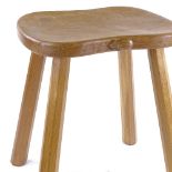 Robert Mouseman Thompson, golden oak stool on tapered octagonal legs, seat dimensions 36cm x 30cm,