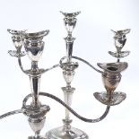 A pair of Edwardian silver three light candelabra, marquise form with removable sconces, central
