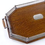 An Edwardian oak tea tray with electroplate mounts, length 58cm No splits or repairs, plated