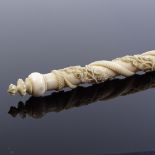 An unusual 19th century ivory rod with relief carved continuous entwined serpent and band of