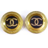 CHANEL - a pair of Vintage gold plated CC logo clip-on earrings, black resin centre panel with