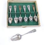 A set of 6 Dutch silver teaspoons and a caddy spoon, pierced and bright-cut engraved handles,