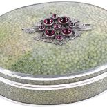 A shagreen and unmarked silver-mounted oval jewel box, with cabochon garnet-mounted lid,