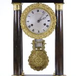 A 19th century French Empire 4-pillar clock, ebony case with ormolu mouldings and mounts, engraved