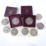 A group of silver crowns and commemorative coins