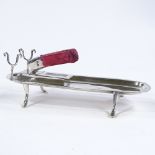 An Edwardian silver desk companion, with scrolled pen rest, hinged sealing wax holder, lidded