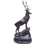 After Joules Moigniez, a patinated bronze sculpture depicting stag on a rocky outcrop, on polished