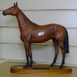 A Beswick Connoisseur figure of Red Rum on wooden plinth