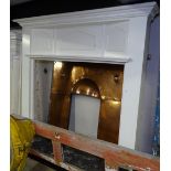 An Arts and Crafts painted pine fire surround, together with original studded copper insert, W145cm,