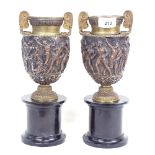 A pair of 19th century relief moulded bronze Classical urns, by John Grinsell & Sons of