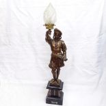 A Renaissance style painted spelter figural lamp sculpture, depicting guard holding flaming torch,