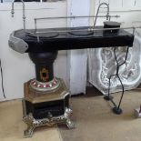 An unusual cast-iron and steel Antique Dutch stove, with enamel decoration, L110cm, H120cm
