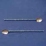 A pair of Russian silver and enamel cocktail spoons