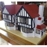 A large Tudor style dolls house