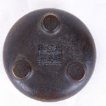 A small Chinese bronze circular censer, 6 character mark underneath, diameter 9cm