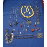 A tray of Eastern white metal jewellery, some silver, amber items