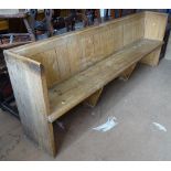 A Victorian polished pine church pew, with panelled back, L229cm, H83cm, D42cm, seat height 43cm,