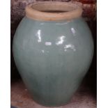 A large green glazed garden plant pot