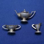 A George V miniature 3-piece silver teaset, comprising teapot, sugar bowl and cream jug, by Levi &