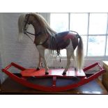 An Antique hide rocking horse, on painted sled base, H90cm