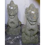 A pair of weathered concrete garden statues, H40cm