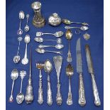 A collection of silver items, to include silver and enamel collector's spoons, silver-handled button