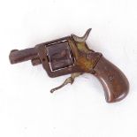 A 19th century miniature percussion pistol, with engraved wood grips and folding trigger, barrel