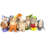 A group of Vintage straw-filled Snow White and the Seven Dwarfs dolls, and a Humpty Dumpty doll