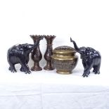 2 African carved ebony elephants, and 3 black enamelled brass posy holders (5)