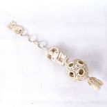 An ornate carved and pierced ivory puzzle ball on chain, circa 1900, overall length 25cm