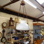 A large cast-brass and milk glass hanging light fitting, with chimney, overall height 95cm