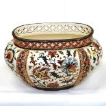 A Zsolnay Pecs Hungarian reticulated pot with floral decoration, length 30cm