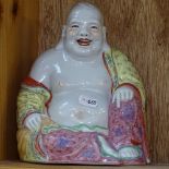 A Chinese painted ceramic Buddha, height 20.5cm