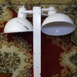 An industrial floor standing double light fitting