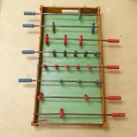 A Vintage folding table-top foosball game