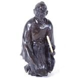 A Chinese bronze sculpture of a kneeling man, unsigned, height 30cm