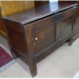 An 18th century joined oak coffer, with panelled front, on stile legs, W96cm, H68cm, D47cm