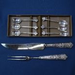 A set of 6 silver coffee spoons, and cased carving set with silver handles