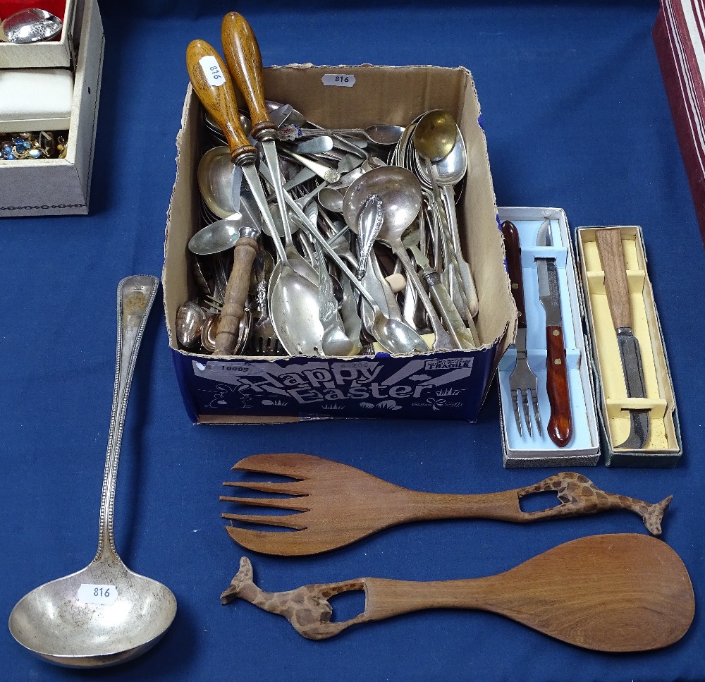 A box of mixed cutlery, including salad servers