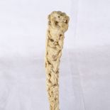 A 19th century relief carved ivory parasol handle, 18ct gold plated collar, handle depicting frogs