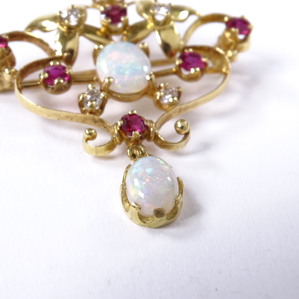 An Art Nouveau style 18ct gold opal, ruby and diamond pendant / brooch, pierced scrollwork settings, - Image 2 of 4