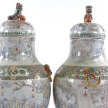 A pair of 19th century Chinese famille rose porcelain jars and covers, hand painted garden scenes