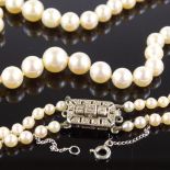 A Vintage double-strand matinee cultured pearl necklace, 9ct white gold diamond set clasp, largest