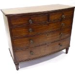 A George III mahogany bow-front chest of drawers, original bras handles and turned feet, width 104cm