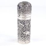 An Indian unmarked silver jar and cover, relief embossed animal and village decoration, height 11.