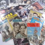 A collection of Marlon Brando film memorabilia, including campaign book, lobby cards, press photos