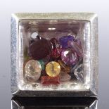 A large sterling silver gemstone window ring, with loose stones under glass panel, setting height